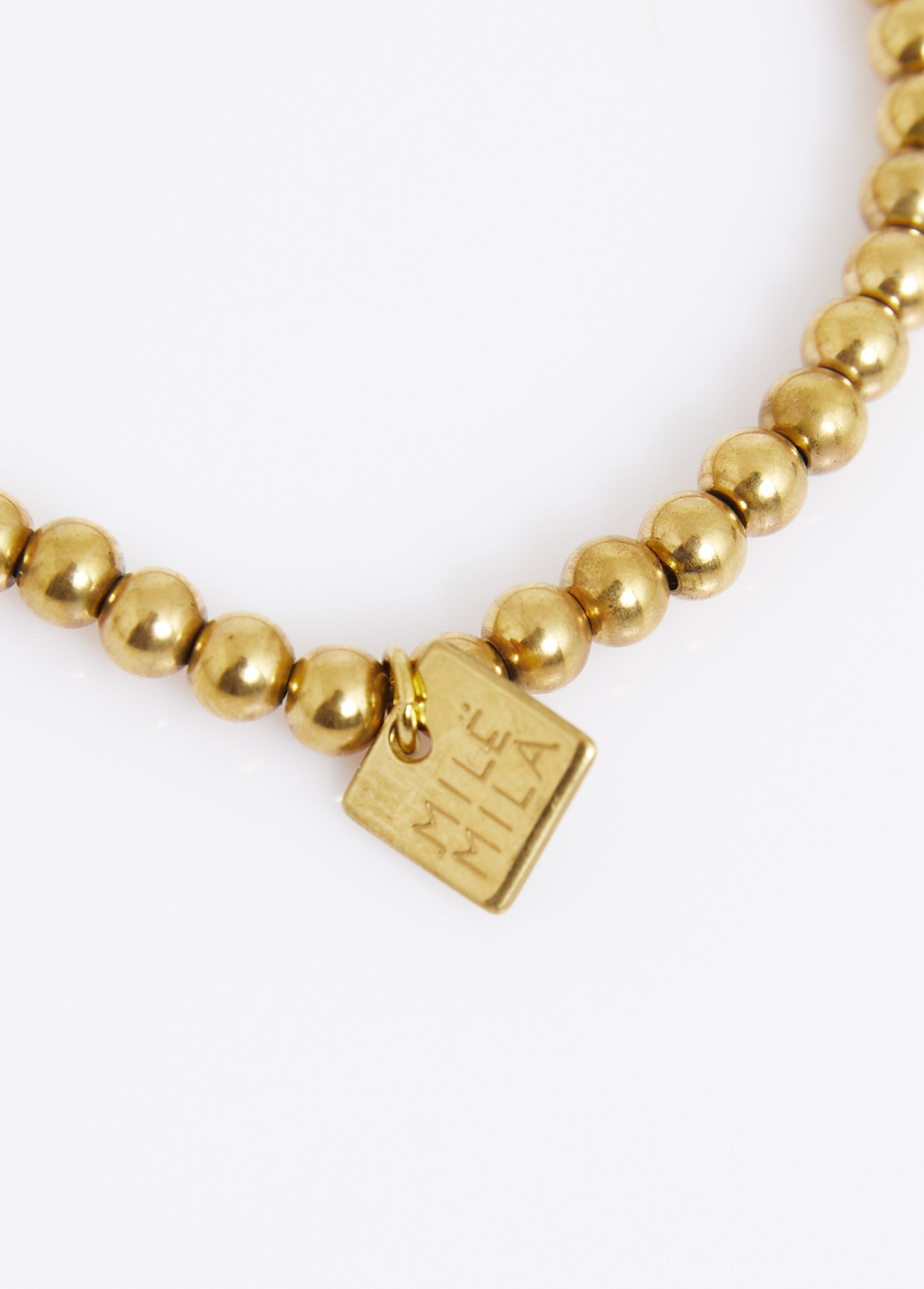 Pulsera_elástica_con_bolas_de_cuentas,_acero._Dorado_DE1_slim