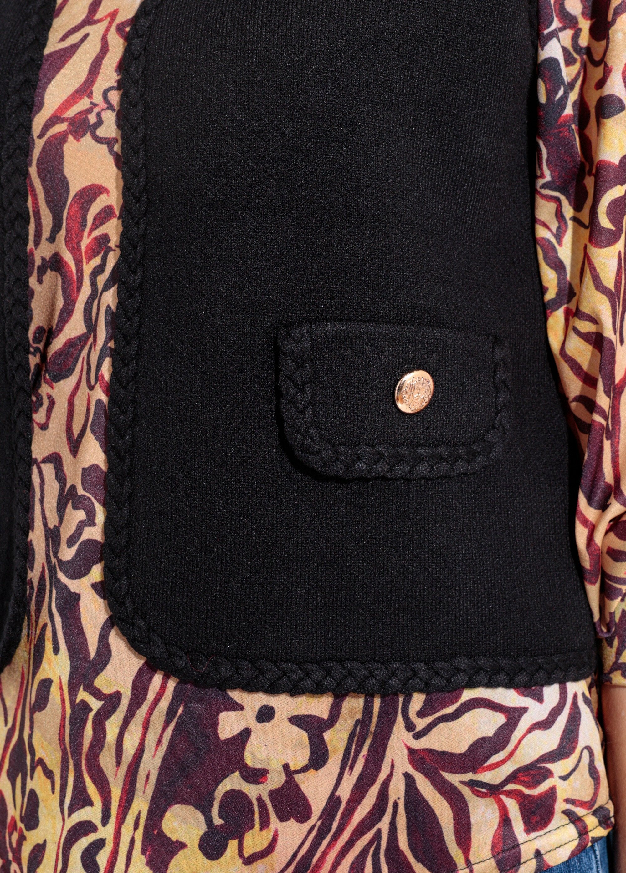 Chaleco_grueso_sin_mangas_con_detalles_trenzados._Negro_DE1_slim