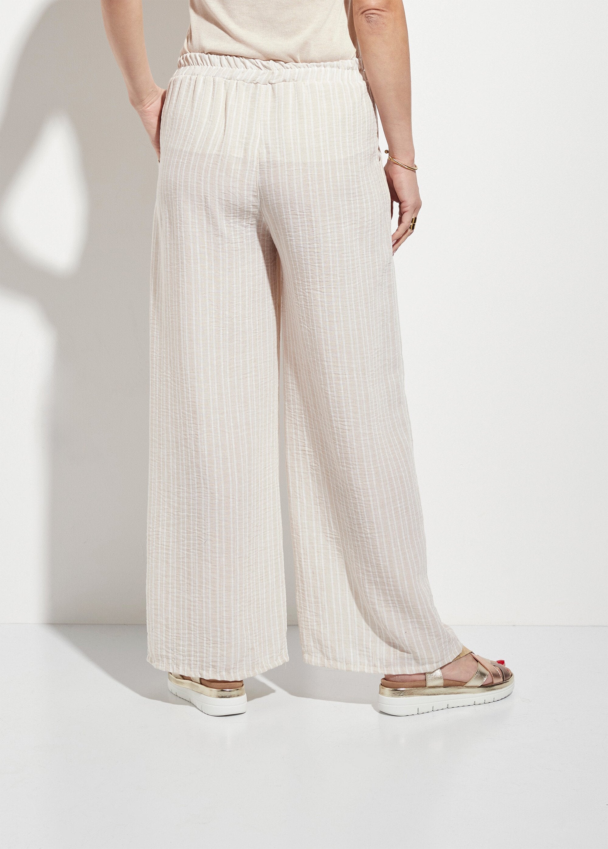 Pantalones_holgados_de_lino_a_rayas_Beige_DO1_slim